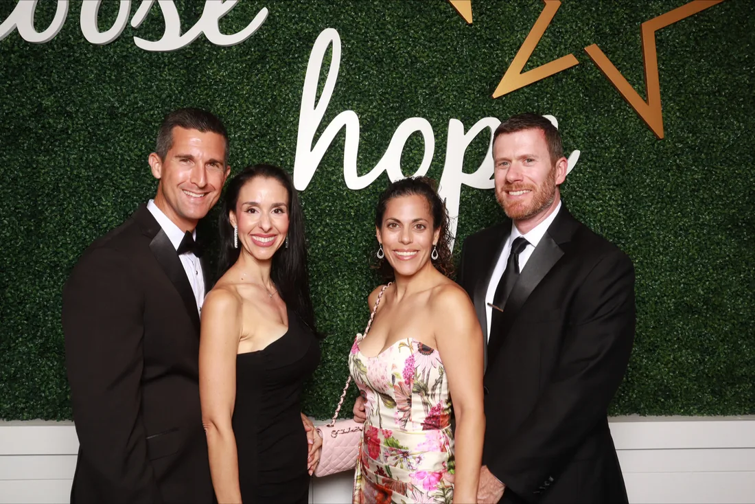 Wedding guests enjoying a Strata Booth photo booth at an Orlando reception