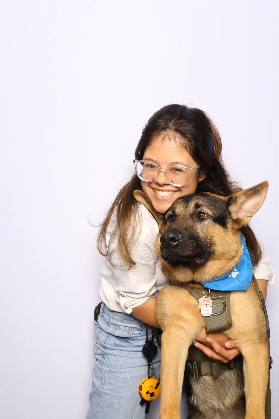 Veterinary professional posing with a dog at the FVMA photo activation