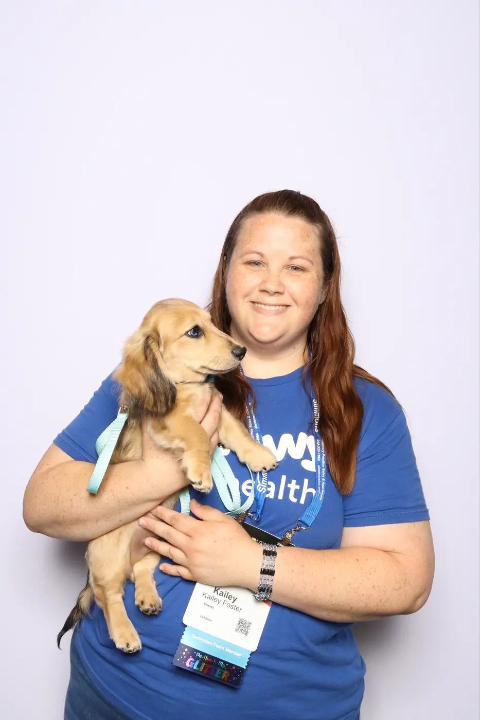 FVMA attendee holding a small dog during the photo mosaic experience